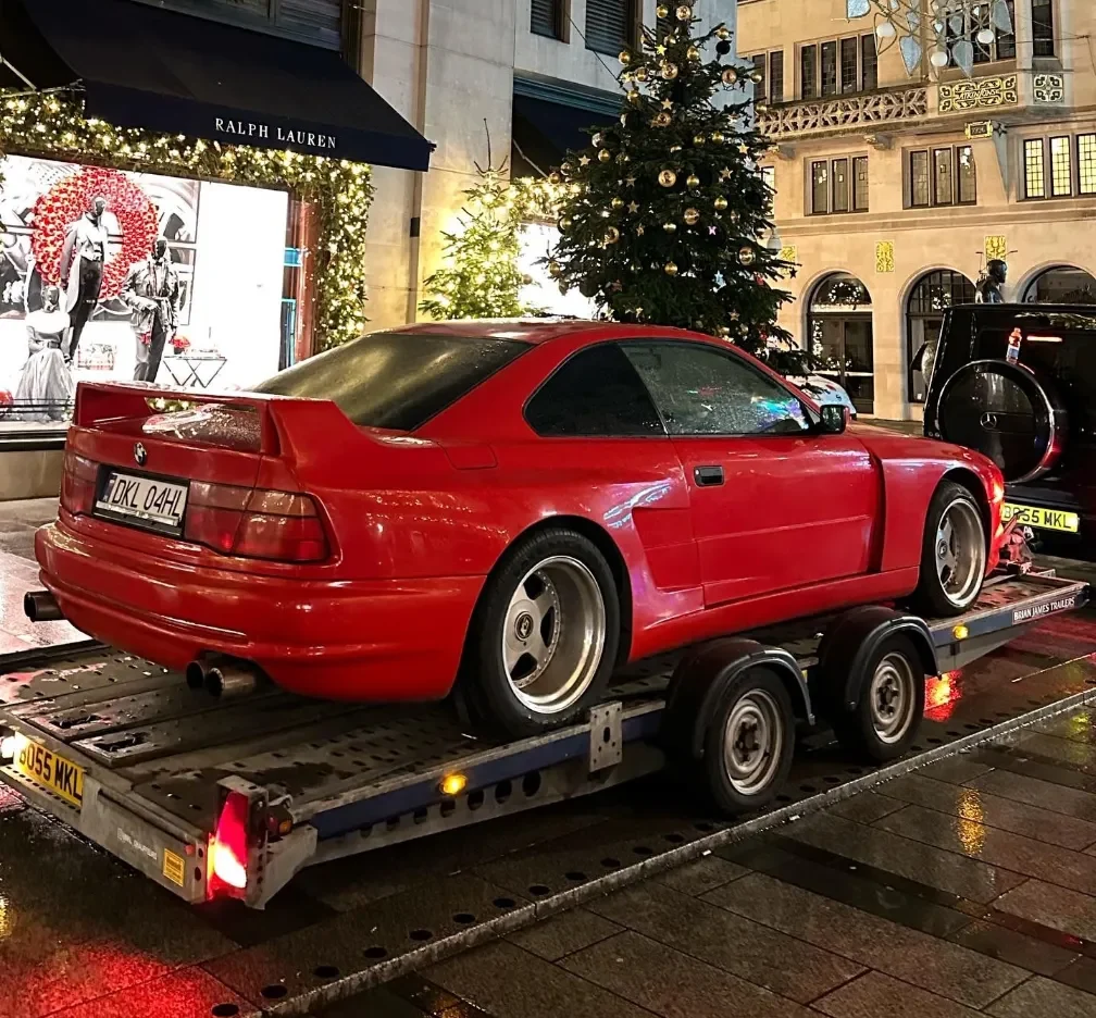 express breakdown recovery luxury red car towing