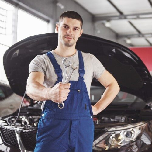 mechanic with wrench in his hands